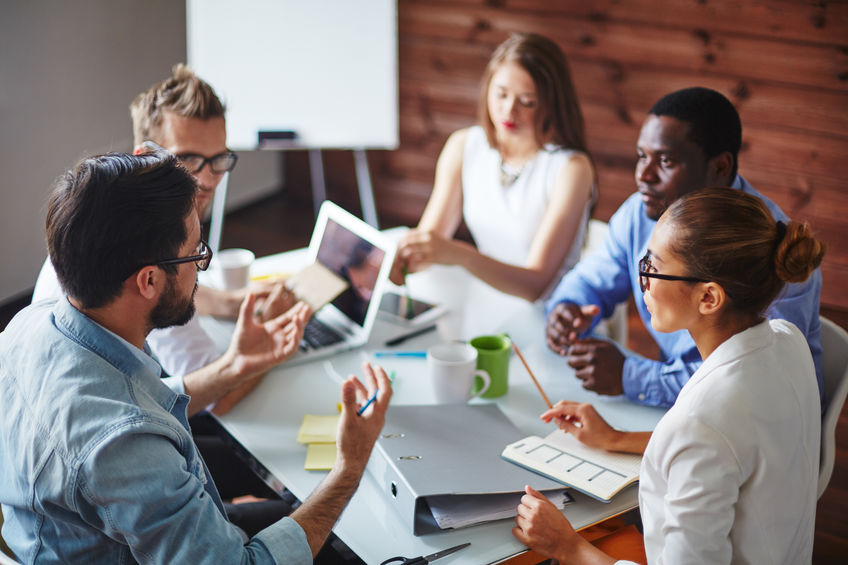 Employees in Ergonomic Office Chairs Using Office Lingo